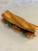 A Le 76 smoked salmon baguette with salad