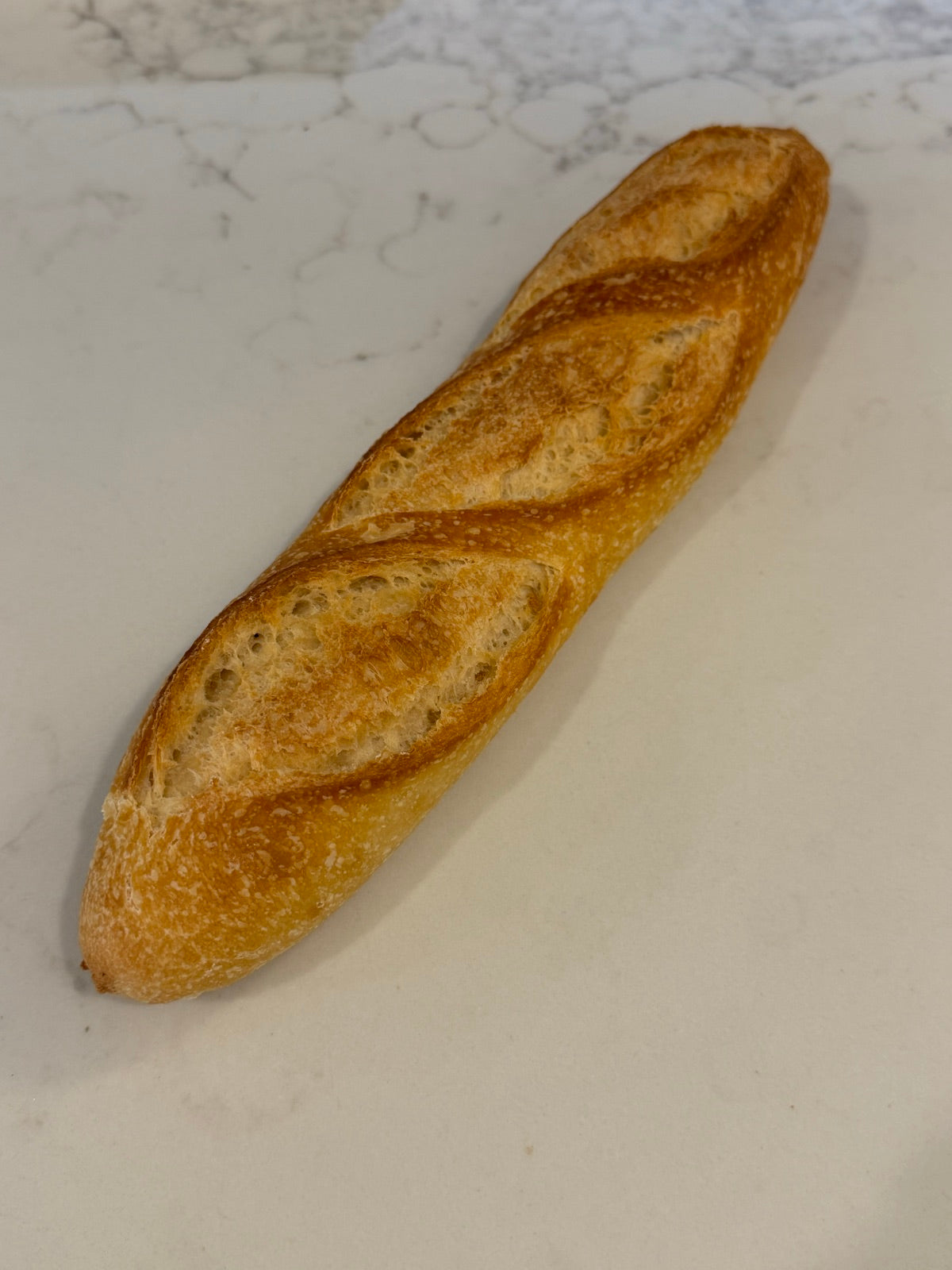 A Le 76 demi baguette, the half length