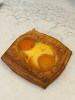 A Le 76 fruit danish with apricot halves set in creme patissiere