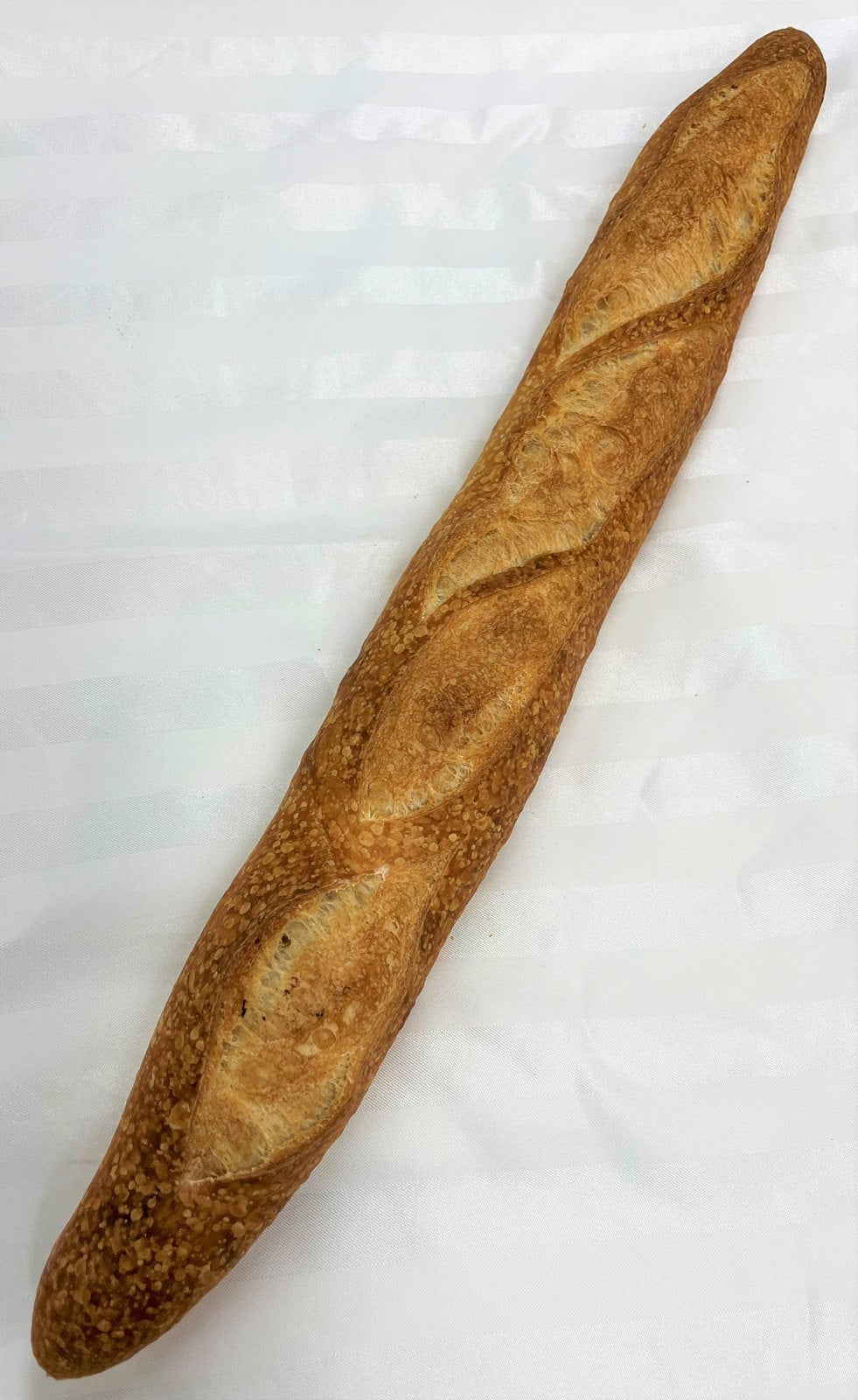 A Le 76 baguette with four diagonal slashes