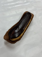 A Le 76 chocolate éclair, choux pastry glazed in dark chocolate