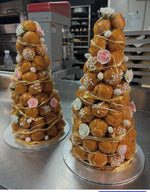 Close view of a Le 76 croque en bouche showing the caramel between the choux buns and the spun sugar veil