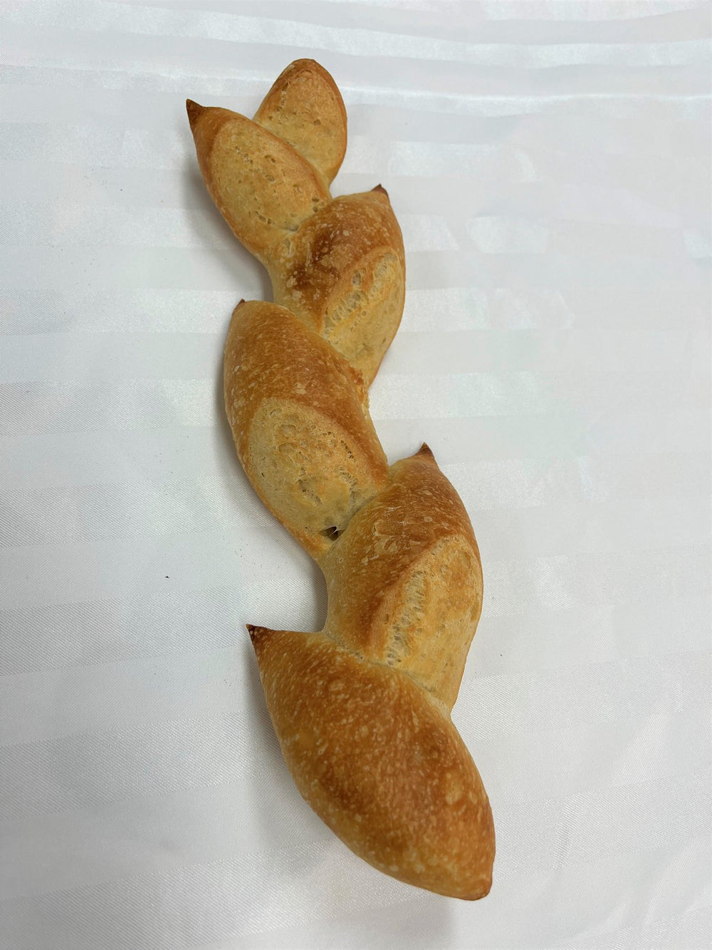 An épi de blé, a baguette cut and folded into a wheat ear shape