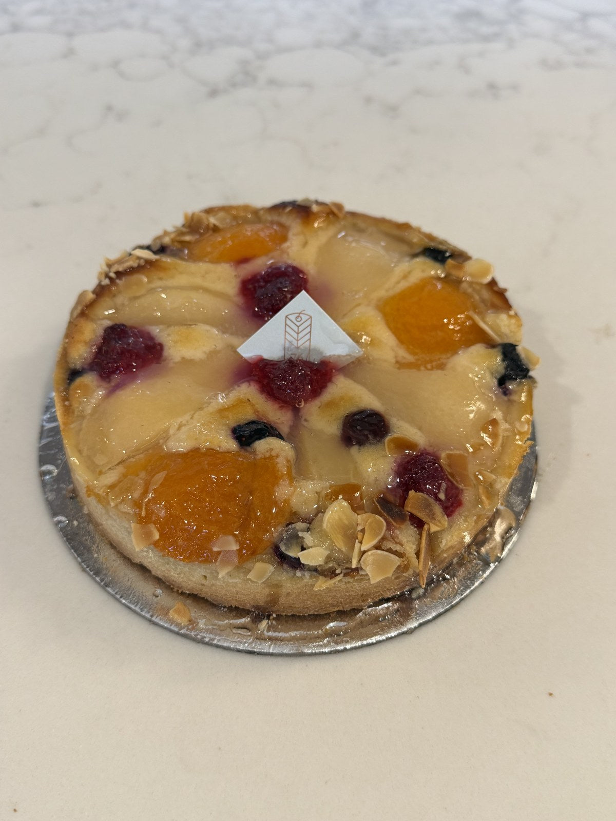 A Le 76 frangipane tart, almond frangipane baked golden with fruit