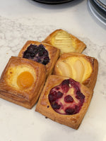 A selection of Le 76 mini danishes with apricot, apple, blueberry and berry