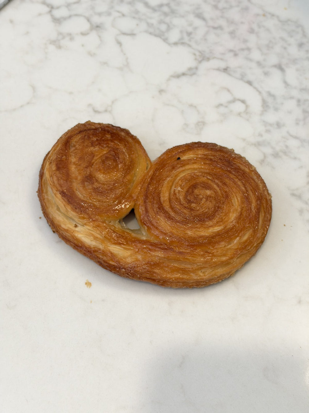 A Le 76 palmier, caramelised puff pastry baked until the edges crisp
